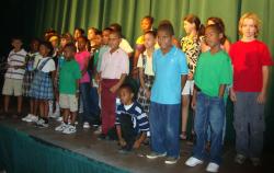 A crowd of young winning artists takes the stage at Caribbean Community Theater for the awards ceremony. A crowd of young winning artists takes the stage at Caribbean Community Theater for the awards ceremony.